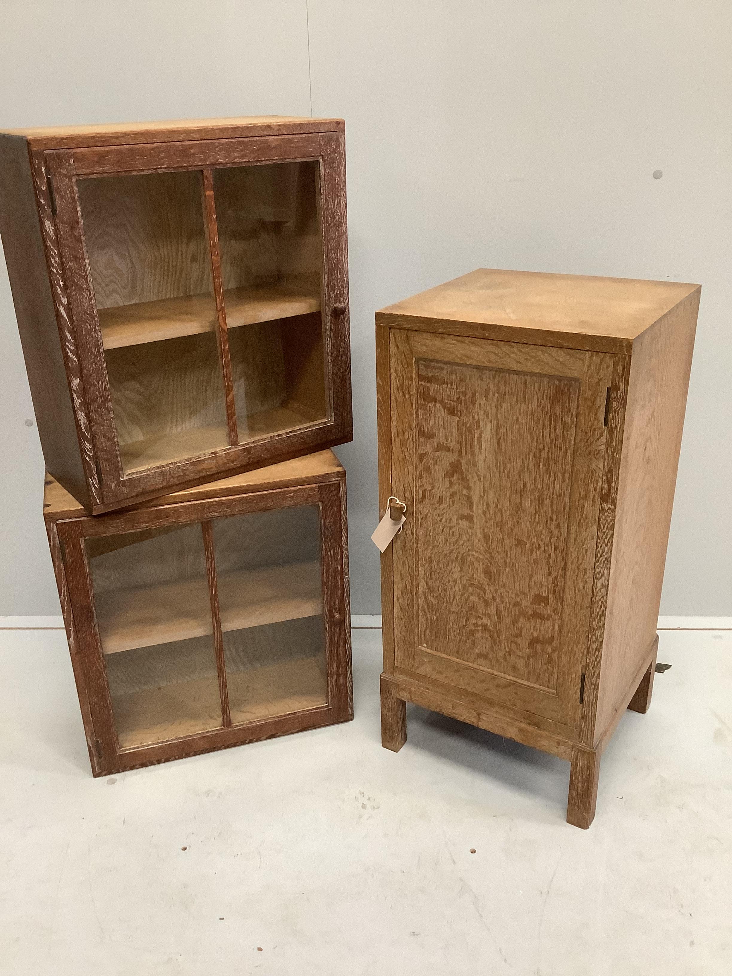 Heal & Son Ltd. London, a bleached oak bedside cabinet, width 36cm, depth 35cm, height 76cm, together with a pair of similar wall cabinets